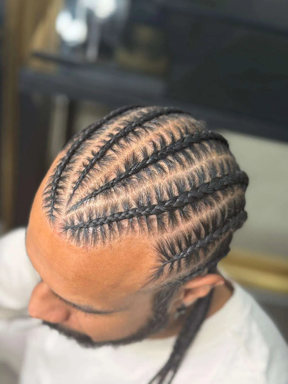 Precise cornrow parting by Zaina